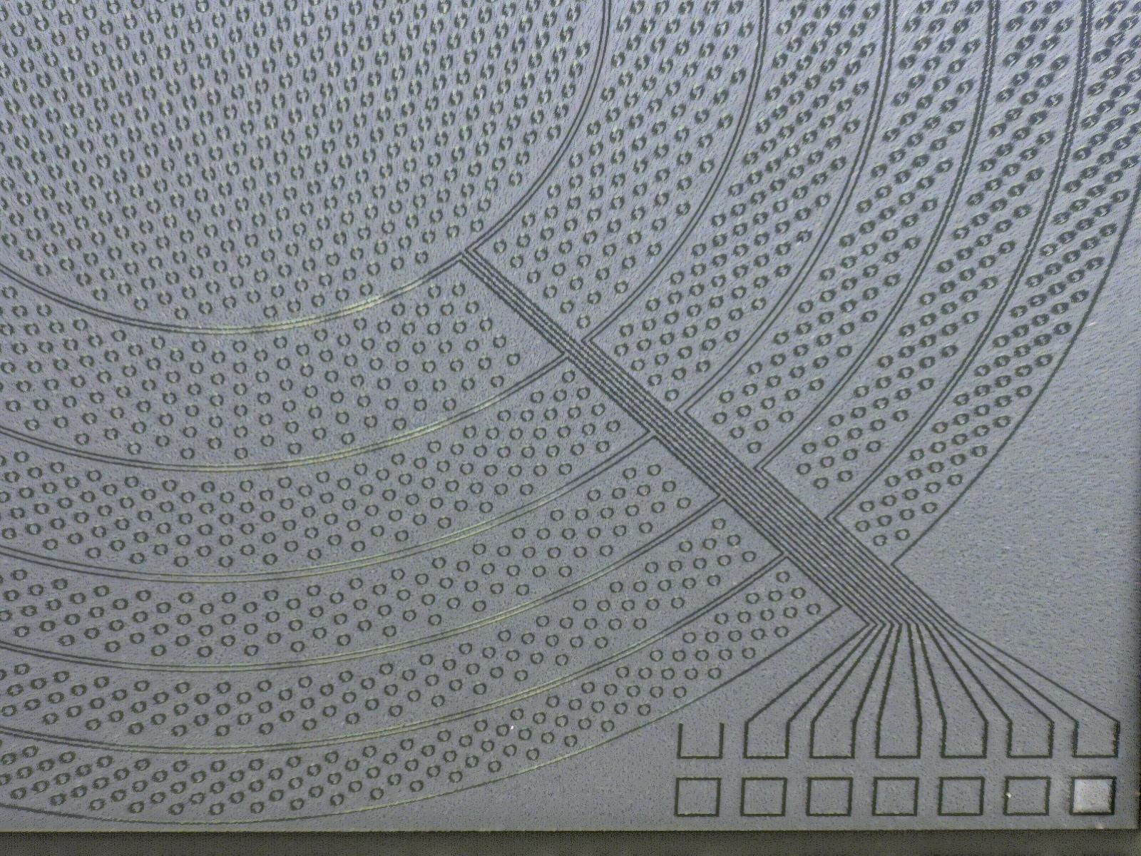 Microscopic image of a PMUT with ring-array design for acoustic focusing.