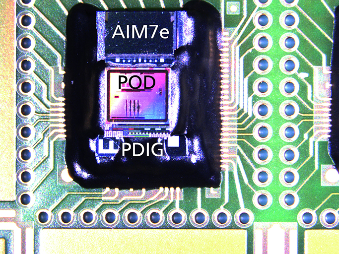 Top view of stacked assembly ”CoolPod” with AIM7e acceleration sensor, ASIC and PDIG.